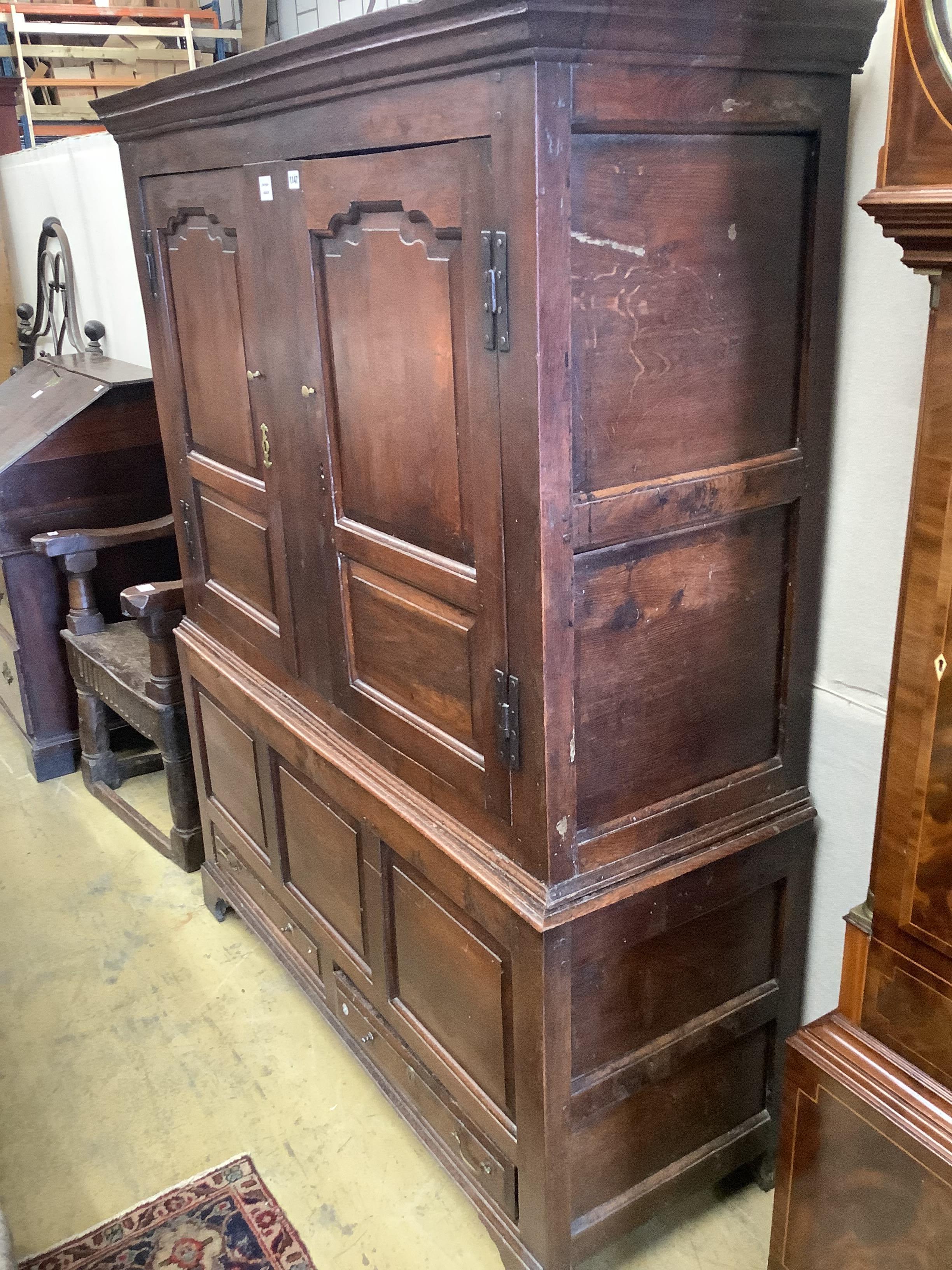 An 18th century panelled oak bacon cupboard